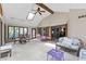 Spacious sunroom features vaulted ceilings, skylights, ample seating, and a ceiling fan at 8909 Ellington Dr, Indianapolis, IN 46234