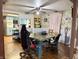 Eclectic dining room with unique wallpaper and a view into the adjacent kitchen at 909 Sullivan St, Alexandria, IN 46001