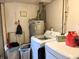 Practical laundry room with a washing machine, dryer, and utility sink at 909 Sullivan St, Alexandria, IN 46001