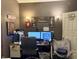 Comfortable office with dual monitors, wall decor, and a cozy chair at 909 Sullivan St, Alexandria, IN 46001