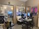 Home office space with mirrored closets, dual monitors and natural lighting at 909 Sullivan St, Alexandria, IN 46001