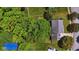 An aerial view shows the property's boundaries, mature trees, lawn, and proximity to the street and adjacent homes at 10172 Watkins Ct, Indianapolis, IN 46234