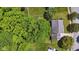 Aerial view of a home showcasing its well-maintained lawn, mature trees, and proximity to nearby streets and greenery at 10172 Watkins Ct, Indianapolis, IN 46234