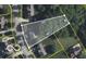 An aerial view displays the property's boundaries and surrounding landscape, highlighting its prime location near mature trees at 10172 Watkins Ct, Indianapolis, IN 46234