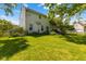 Spacious backyard with mature trees, green grass, and a fence, perfect for relaxing and enjoying the outdoors at 10172 Watkins Ct, Indianapolis, IN 46234