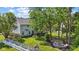 Expansive backyard featuring a stone patio, fire pit, and lush green lawn, perfect for outdoor entertaining at 10172 Watkins Ct, Indianapolis, IN 46234
