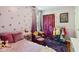 Whimsical bedroom with heart decals, decorative curtains and fun artwork at 10172 Watkins Ct, Indianapolis, IN 46234