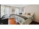 Bright bedroom with hardwood floors, three windows, stylish curtains, and modern decor at 10172 Watkins Ct, Indianapolis, IN 46234