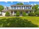 Charming two-story home with a large front porch and manicured lawn, offering a welcoming curb appeal at 10172 Watkins Ct, Indianapolis, IN 46234