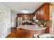 Spacious kitchen with stainless steel appliances, hardwood floors, and breakfast bar at 10172 Watkins Ct, Indianapolis, IN 46234