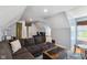 Comfortable living room with a sectional sofa, hardwood floors, and custom design details at 10172 Watkins Ct, Indianapolis, IN 46234