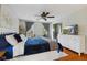 Well-lit main bedroom with hardwood floors, ceiling fan, and ample closet space at 10172 Watkins Ct, Indianapolis, IN 46234