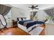 Inviting main bedroom featuring a ceiling fan, hardwood floors and natural light at 10172 Watkins Ct, Indianapolis, IN 46234