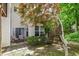 Cozy backyard with a patio, comfortable seating, mature trees, and lots of natural light at 1030 Longwell Pl, Indianapolis, IN 46240