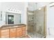 A full bathroom featuring a glass shower and granite counters at 1030 Longwell Pl, Indianapolis, IN 46240
