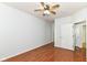 An empty bedroom featuring wood-look floors and a ceiling fan at 1030 Longwell Pl, Indianapolis, IN 46240