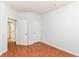 This empty bedroom features wood-look floors and access to a bathroom at 1030 Longwell Pl, Indianapolis, IN 46240