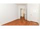 An empty bedroom featuring wood-look floors and access to a bathroom at 1030 Longwell Pl, Indianapolis, IN 46240