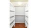 This walk-in closet features wood-look floors and shelving at 1030 Longwell Pl, Indianapolis, IN 46240
