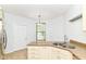 Kitchen featuring granite countertops, stainless steel appliances, and natural light from the window at 1030 Longwell Pl, Indianapolis, IN 46240