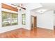 Inviting living room with hardwood floors, large windows, and a ceiling fan at 1030 Longwell Pl, Indianapolis, IN 46240
