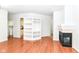 Bright living room featuring built in shelves and a fireplace with white trim at 1030 Longwell Pl, Indianapolis, IN 46240