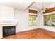 Cozy living room with a fireplace, hardwood floors, and plenty of natural light at 1030 Longwell Pl, Indianapolis, IN 46240