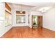 Open living room featuring hardwood floors, a ceiling fan, and access to the backyard at 1030 Longwell Pl, Indianapolis, IN 46240