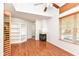 Bright living room with hardwood floors, fireplace, and a built-in bookshelf at 1030 Longwell Pl, Indianapolis, IN 46240
