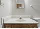 Bathroom with a marble countertop vanity and mirror, accented by gray walls at 105 Meadowview Ln, Greenwood, IN 46142