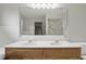 Bright bathroom featuring double sinks and a large mirror at 105 Meadowview Ln, Greenwood, IN 46142