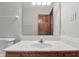 Bathroom with marble counter and a view of the entry door via mirror at 105 Meadowview Ln, Greenwood, IN 46142