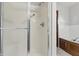 Bathroom features a glass door shower and a large tub at 105 Meadowview Ln, Greenwood, IN 46142