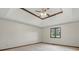 Large bedroom featuring tray ceilings with wood trim and a window view at 105 Meadowview Ln, Greenwood, IN 46142