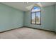 Bedroom with large arched window letting in natural light at 105 Meadowview Ln, Greenwood, IN 46142