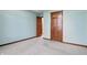 Bedroom with two wooden doors and neutral carpeting at 105 Meadowview Ln, Greenwood, IN 46142