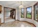 Dining area with bay window, light fixture and open view of the living room at 105 Meadowview Ln, Greenwood, IN 46142