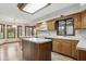 Well-lit kitchen featuring a center island, ample counter space, and views of the surrounding outdoors at 105 Meadowview Ln, Greenwood, IN 46142