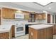 Traditional kitchen showcasing wood cabinets, white appliances, countertops and ample counter space at 105 Meadowview Ln, Greenwood, IN 46142