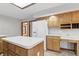 Bright kitchen featuring a large island, wood cabinets, white appliances, and ample counter space at 105 Meadowview Ln, Greenwood, IN 46142