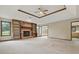 Spacious living room featuring a brick fireplace, built-in shelving, and abundant natural light at 105 Meadowview Ln, Greenwood, IN 46142