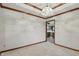 Bright and airy room with a chandelier, views of kitchen, and tasteful trim detail at 105 Meadowview Ln, Greenwood, IN 46142