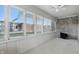 Sunroom with exposed brick and abundant natural light at 105 Meadowview Ln, Greenwood, IN 46142