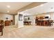 Finished basement with a pool table and bar area, great for entertaining at 10784 Giselle Way, Fishers, IN 46040