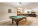 Basement featuring a pool table, bar, and living area, perfect for entertaining guests at 10784 Giselle Way, Fishers, IN 46040