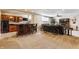 Finished basement with a bar, mounted TV, modern lighting, and comfortable seating area for relaxation and entertainment at 10784 Giselle Way, Fishers, IN 46040