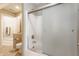 Bathroom featuring shower, toilet, and bath with white fixtures and a sliding shower door and tile floor at 10784 Giselle Way, Fishers, IN 46040
