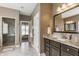Stylish bathroom with granite countertops, dark cabinetry, and a glass-enclosed shower at 10784 Giselle Way, Fishers, IN 46040