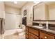 Bathroom featuring a granite counter, tile flooring, shower, and white toilet, vanity, and bath with lots of natural light at 10784 Giselle Way, Fishers, IN 46040