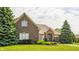 Charming brick home with large trees and well-kept landscaping at 10784 Giselle Way, Fishers, IN 46040